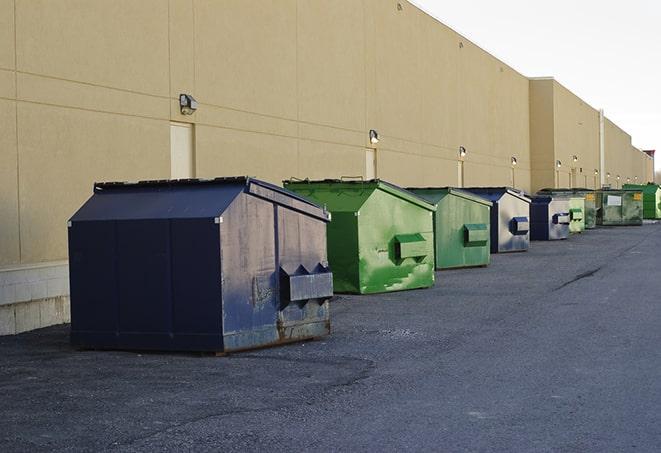 construction waste being loaded into large dumpsters in Christmas